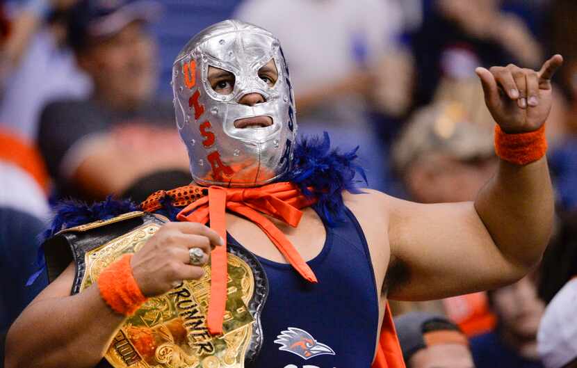 A Texas-San Antonio fan known as El Gran Beak cheers during the first half of an NCAA...