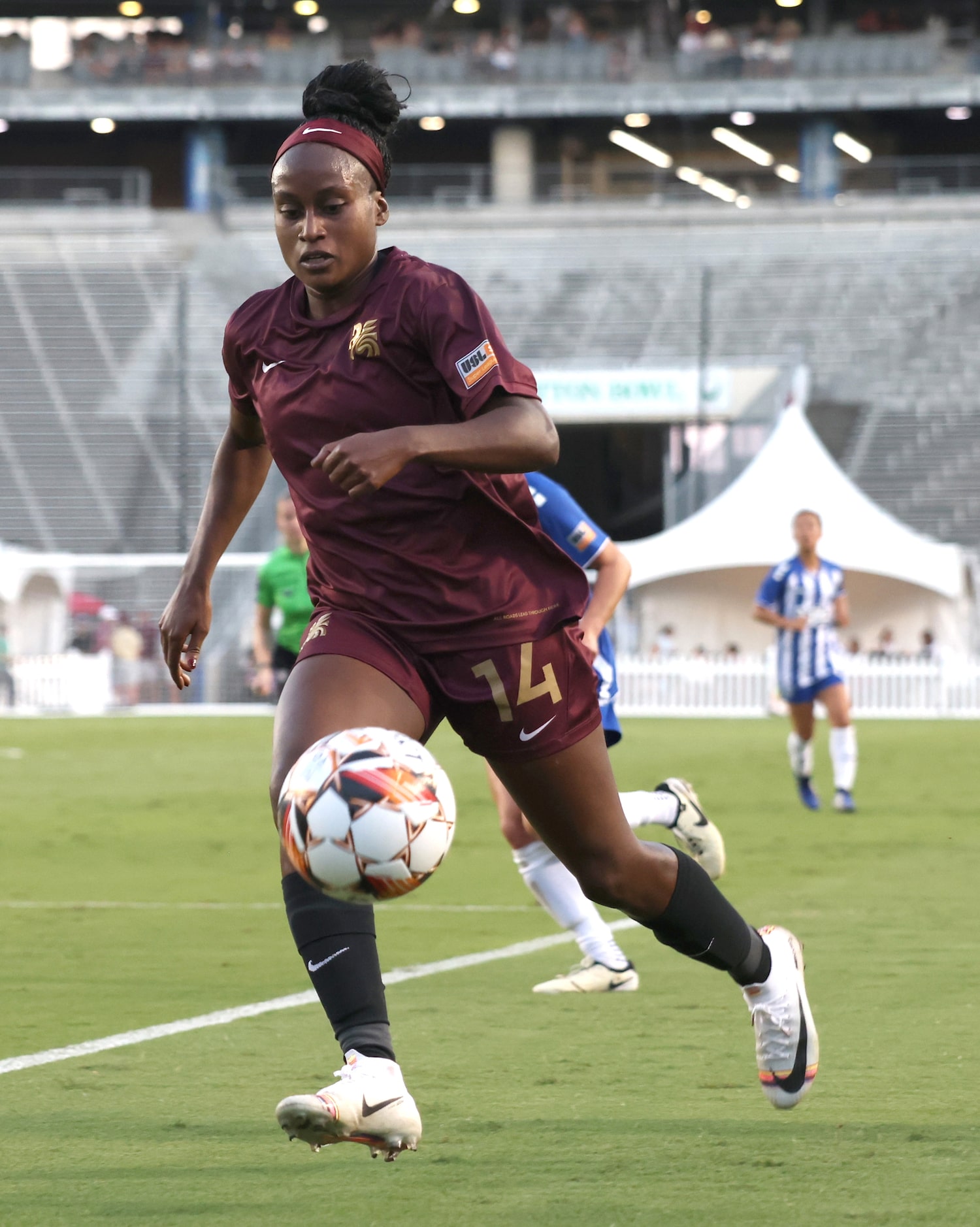 Dallas Trinity FC's Chioma Ubogagu (14) eyes a throw-in from a teammate as she moves toward...