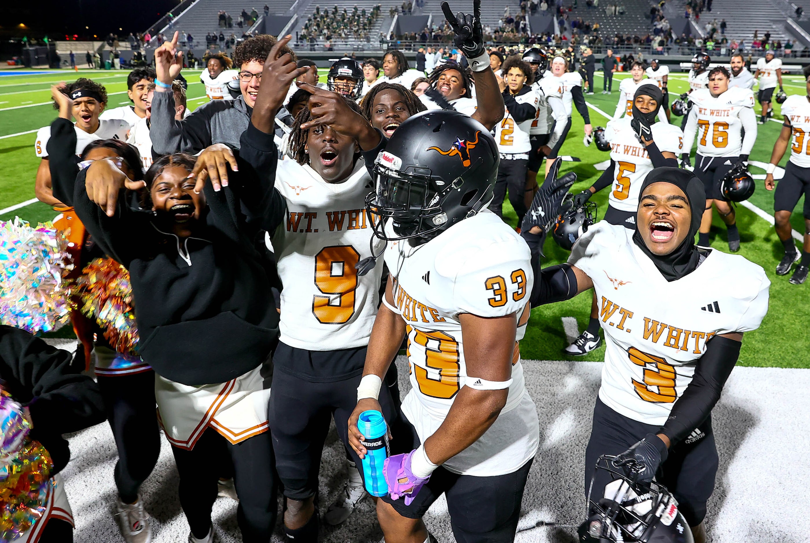 W.T. White Longhorns celebrate their victory over Birdville, 38-35 in overtime in a District...