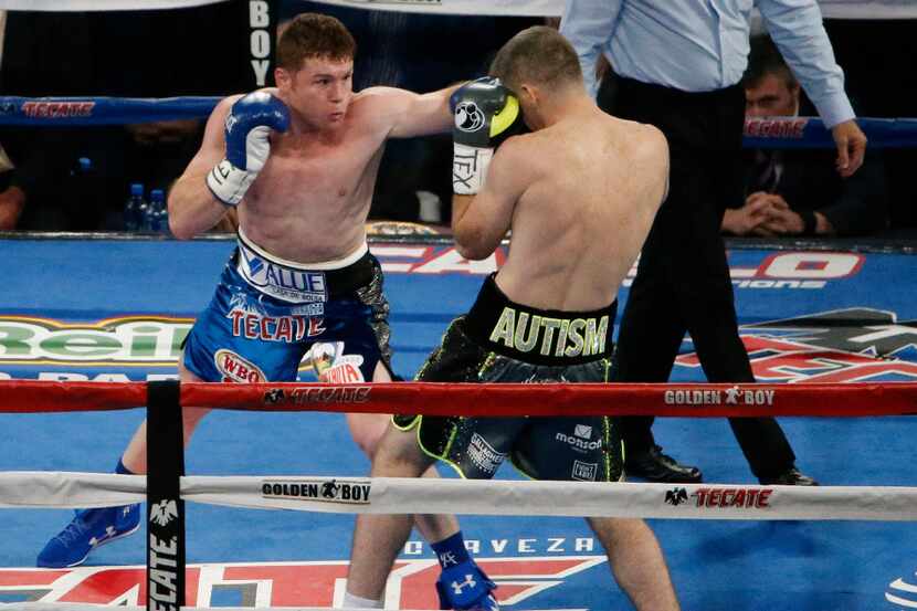 Canelo Alvarez, left, fights Liam Smith in Round 1 for the WBO Junior Middleweight title at...