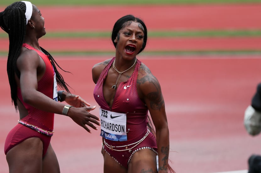 United States' Sha'Carri Richardson, right, celebrates her second-place finish in the...