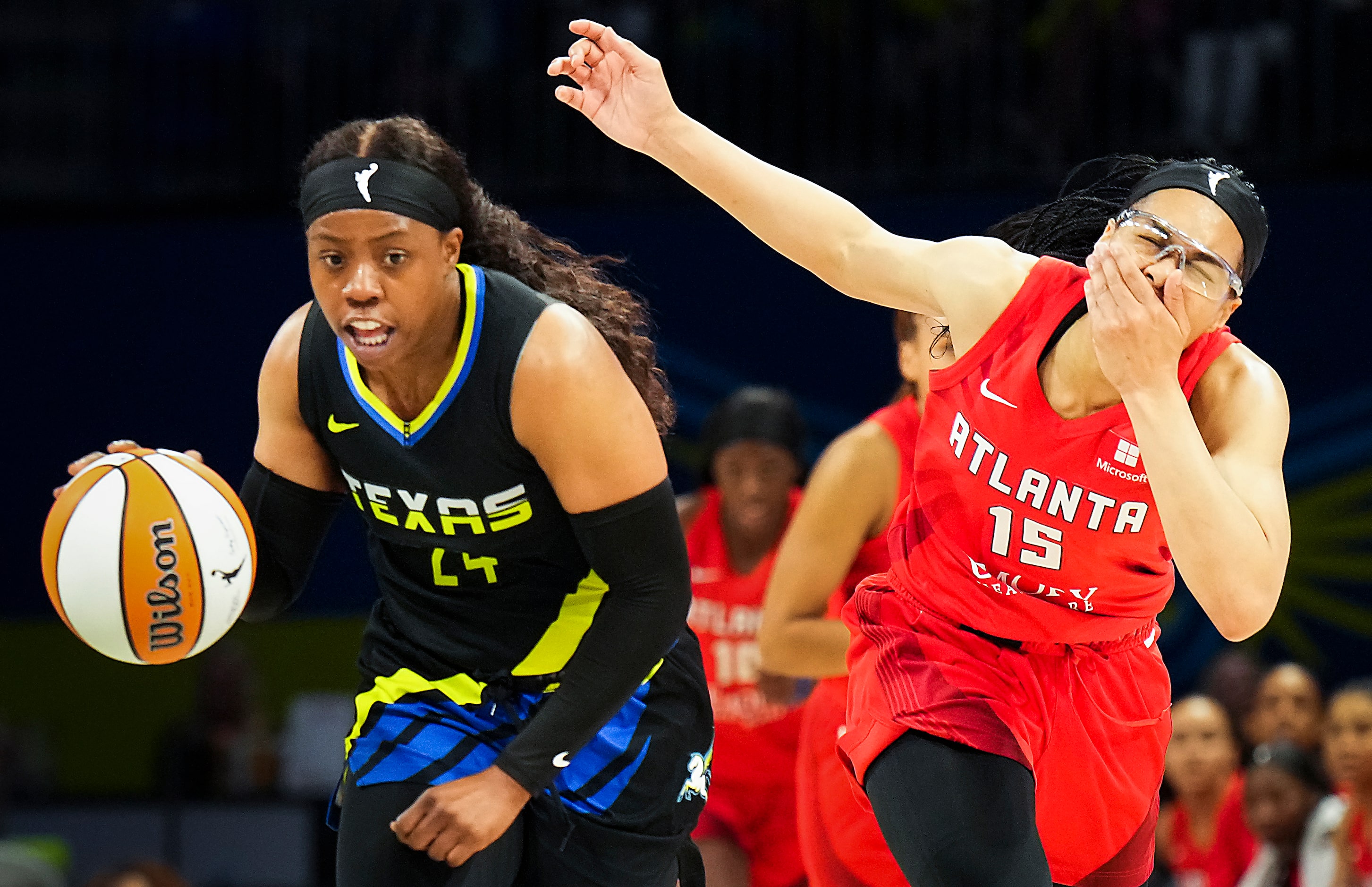 Atlanta Dream guard Allisha Gray (15) reacts after being fouled by Dallas Wings guard Arike...