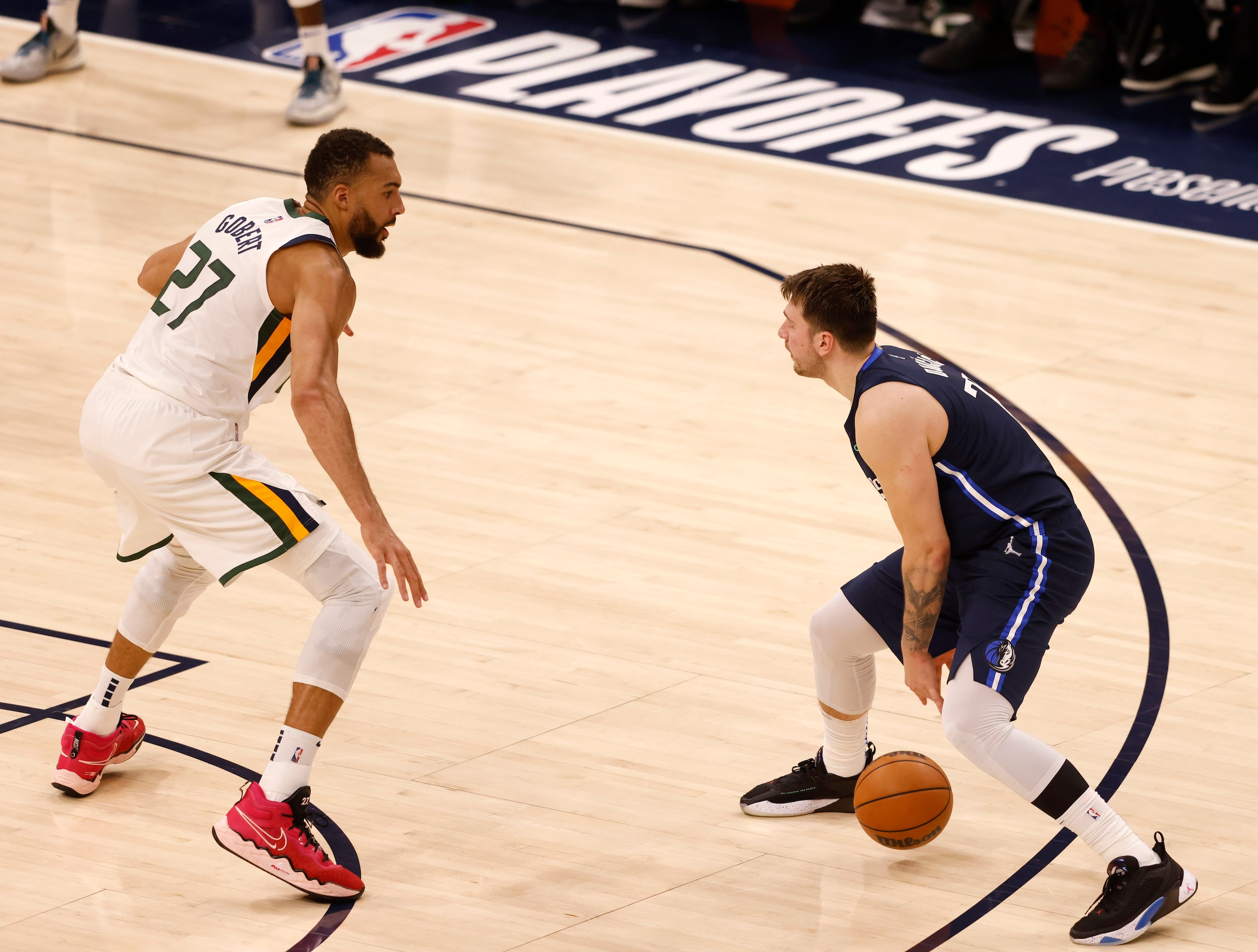 Dallas Mavericks guard Luka Doncic (77) dribbles in front of Utah Jazz center Rudy Gobert...