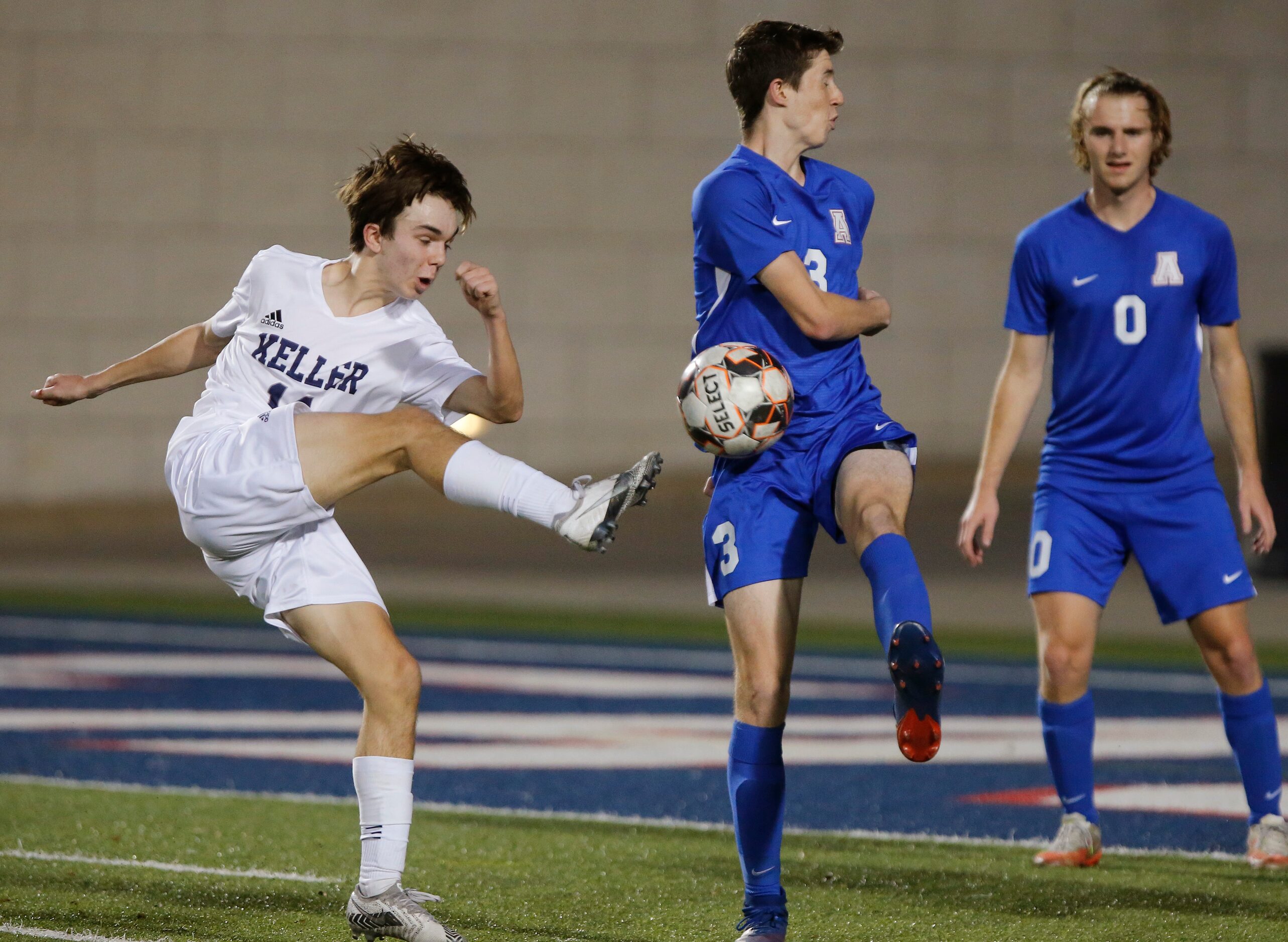 Keller midfielder Cason Walborn (14) has his shot attempt blocked by Allen defender Isaiah...