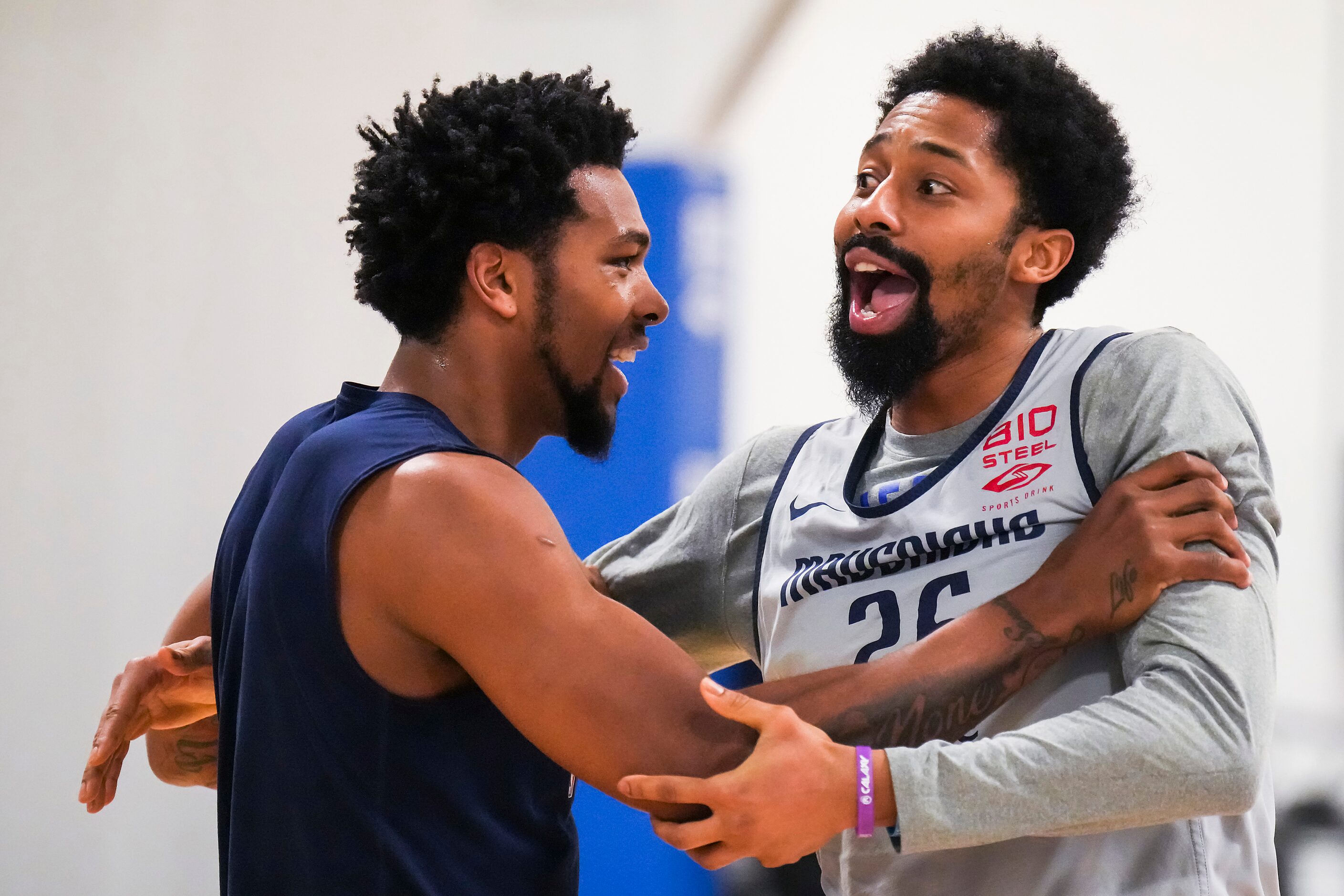 Dallas Mavericks guard Spencer Dinwiddie (26) horses around with forward Sterling Brown as...