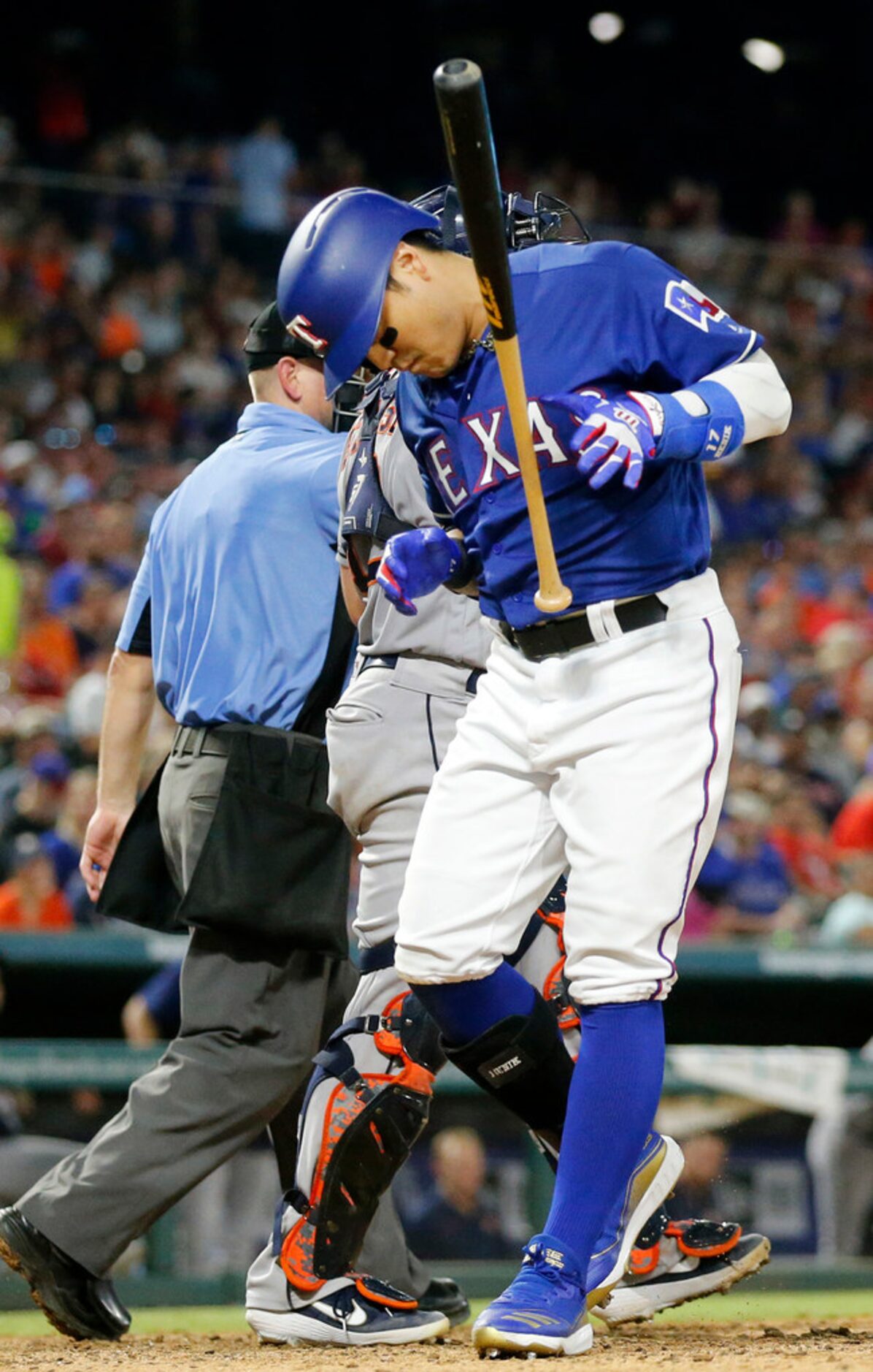 Texas Rangers left fielder Shin-Soo Choo (17) reacts after being hit by Houston Astros...