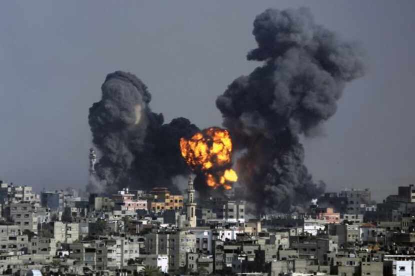 
Smoke and fire from the explosion of an Israeli strike rise over Gaza City, Tuesday, July...