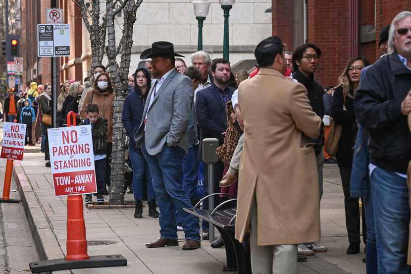 Trump supporters and church members of First Baptist Dallas wait in line for Sunday morning...