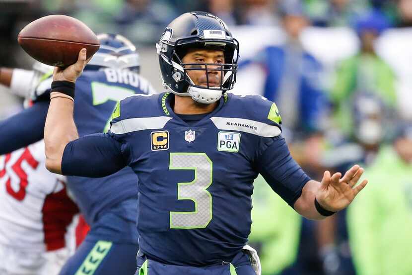 SEATTLE, WA - DECEMBER 30: Russell Wilson #3 of the Seattle Seahawks throws the ball in the...
