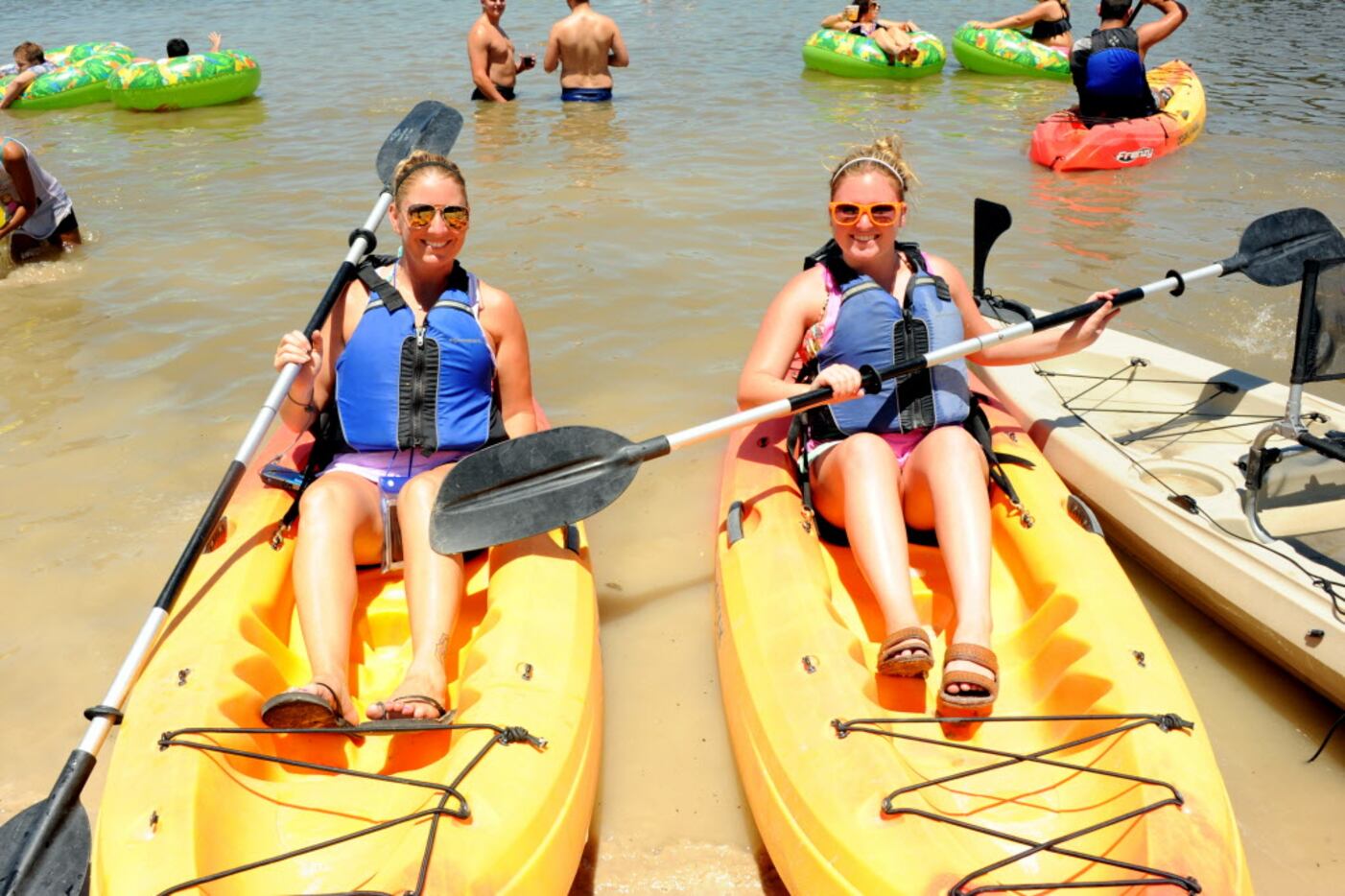 Friends canoe in the Trinity River at Sunday Funday at Panther Island Pavilion