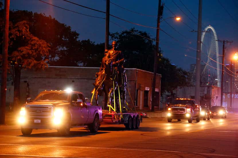 The Robert E. Lee statue got a police escort on Singleton Boulevard in Dallas after its...