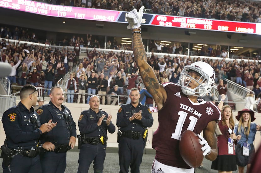 Texas A&M Aggies wide receiver Josh Reynolds (11) gestures as he is applauded by people on...