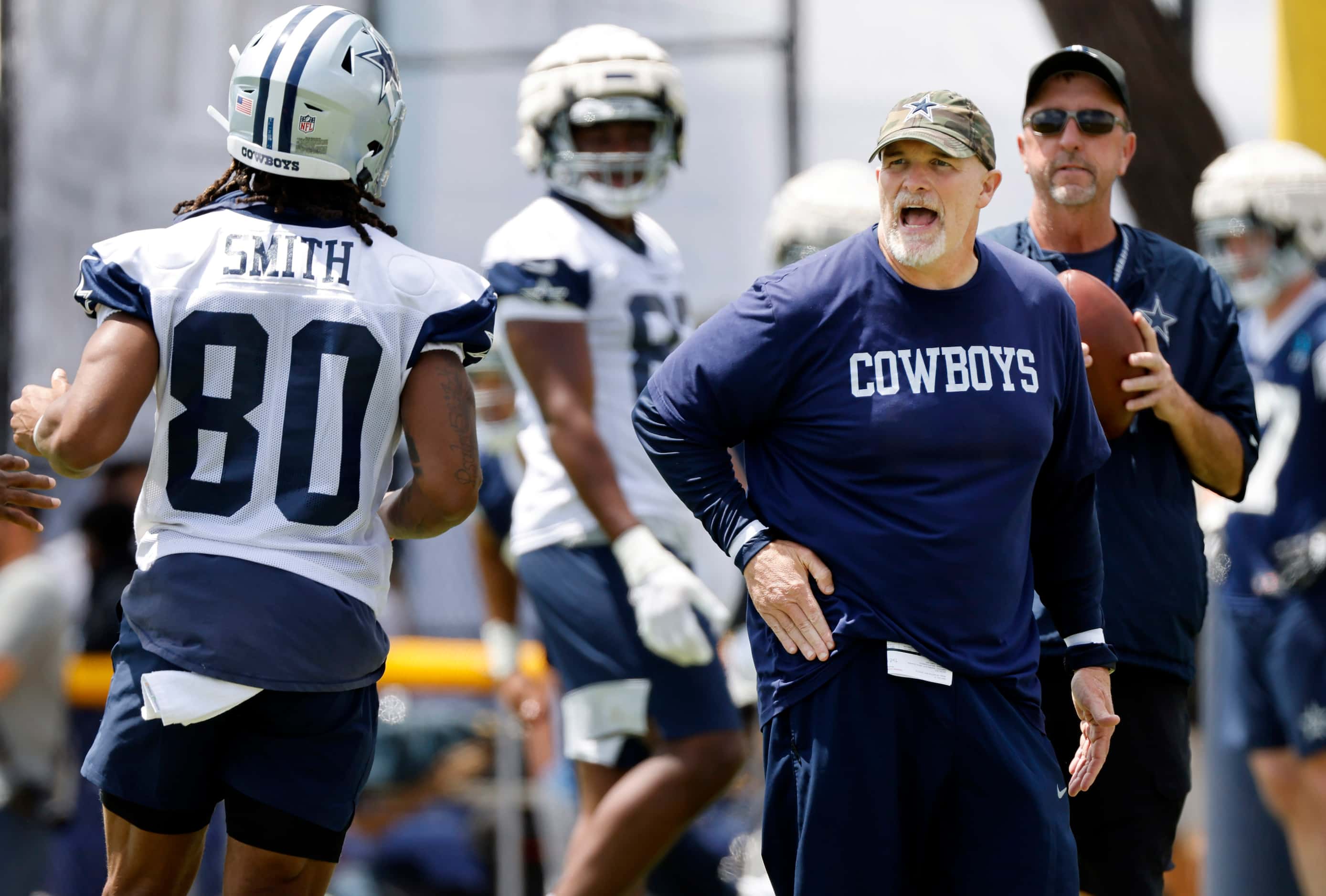Dallas Cowboys defensive coordinator Dan Quinn yells at his defender covering wide receiver...