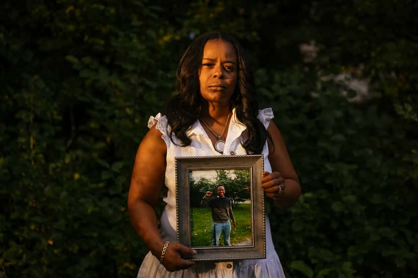 Rafiah Maxie holds a photo of her son, Jamal Clay, outside her home on July 9, 2021, in...