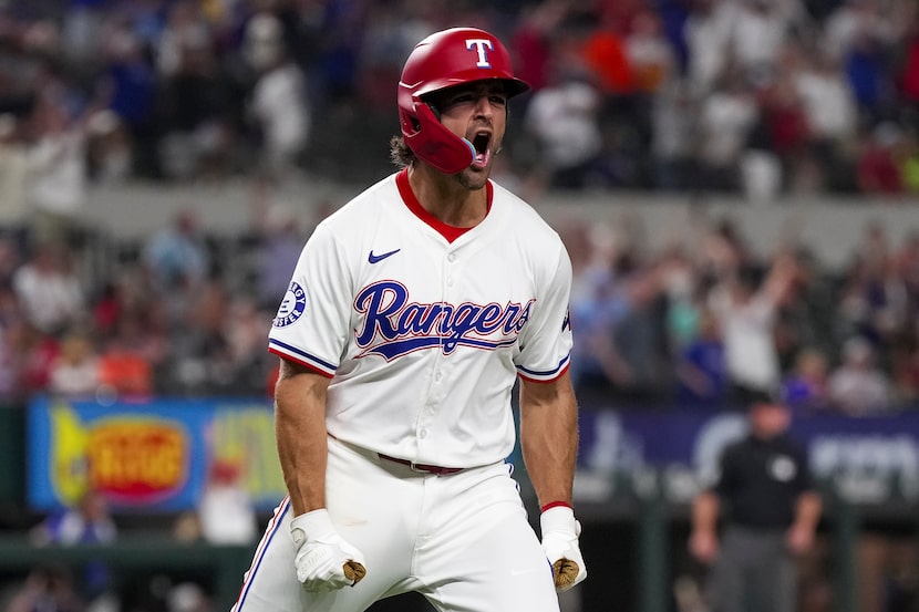 Texas Rangers' Josh Smith celebrates after hitting a walk-off two-run home run during the...