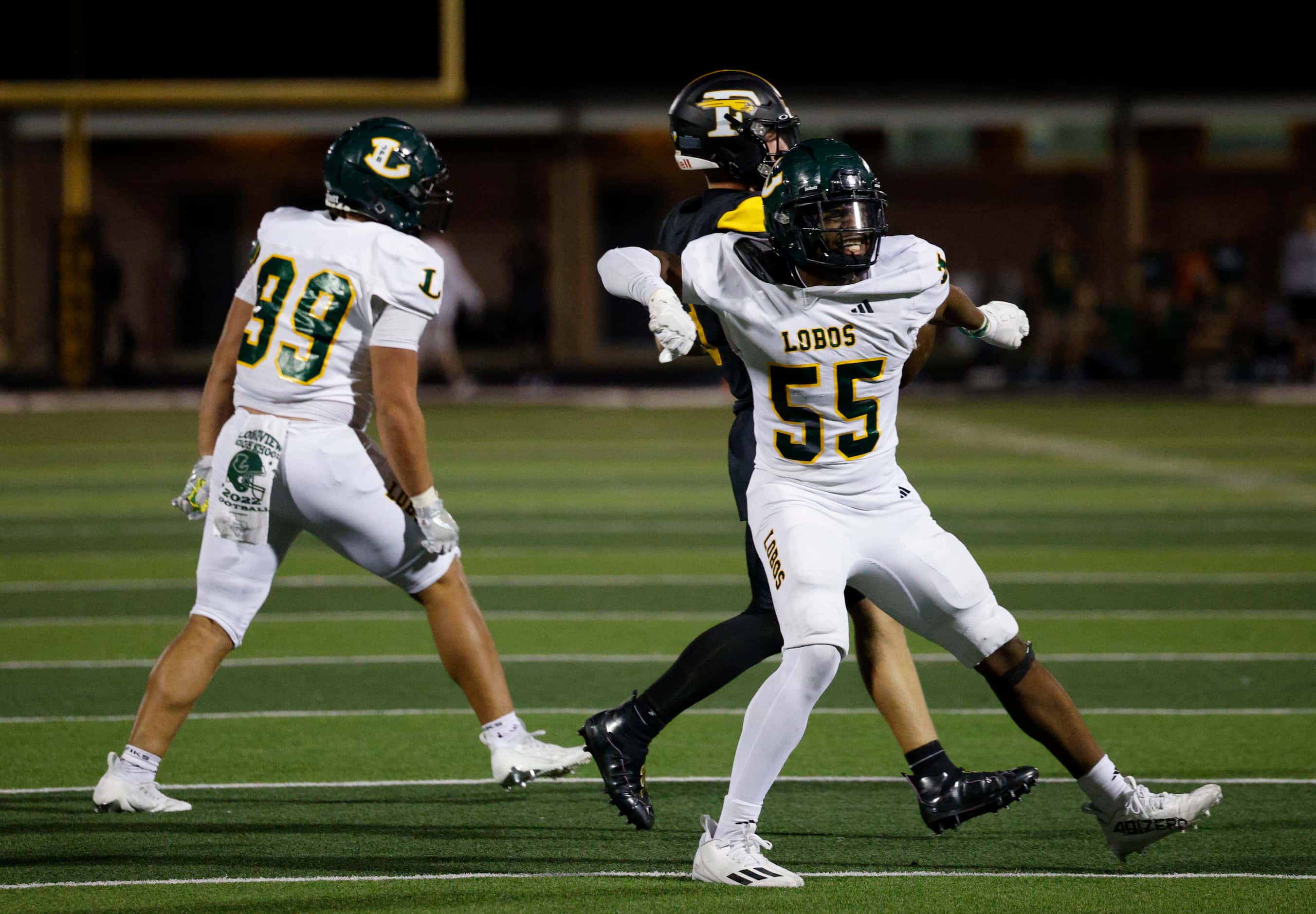 Longview's Xaryus Sheppard (55) and Longview's Billy Smith (99), react after they sacked...