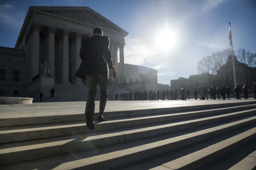 People lined up Monday to enter the U.S. Supreme Court on the first day of January sessions...