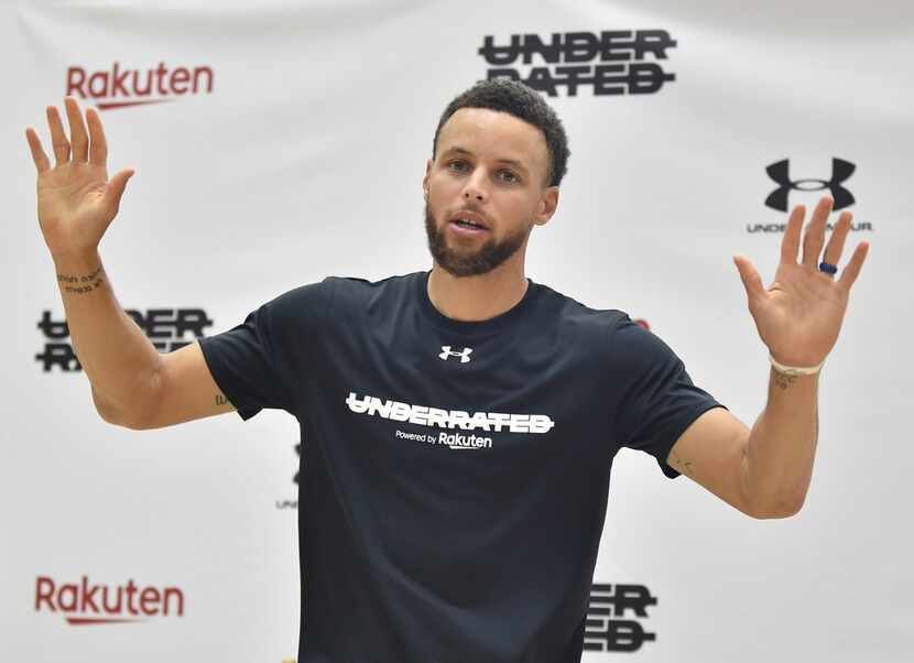 Stephen Curry of the Golden State Warriors gestures during a news conference on his...