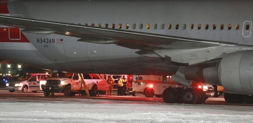 
An American Airlines plane that was headed to Milan from Miami sits at the airport in St....