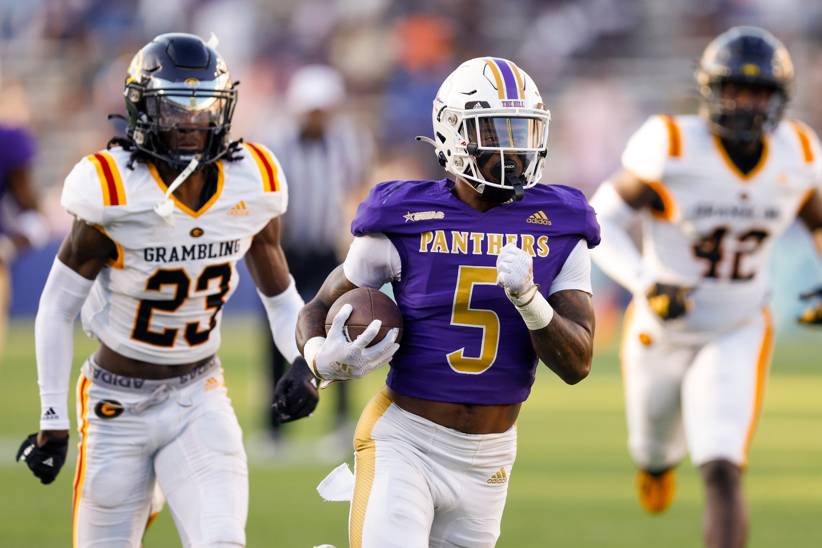 Prairie View A&M running back Ahmad Antoine (5) runs the ball ahead of Grambling State...