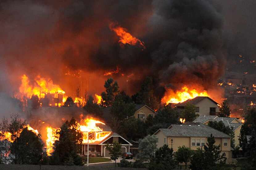 The Waldo Canyon Fire burns an entire neighborhood near the foothills of Colorado Springs,...