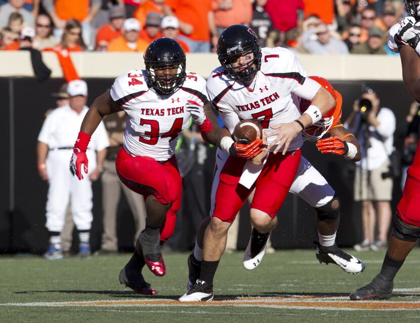 Nov 17, 2012; Stillwater OK, USA; Texas Tech Red Raiders quarterback Seth Doege (7) runs the...