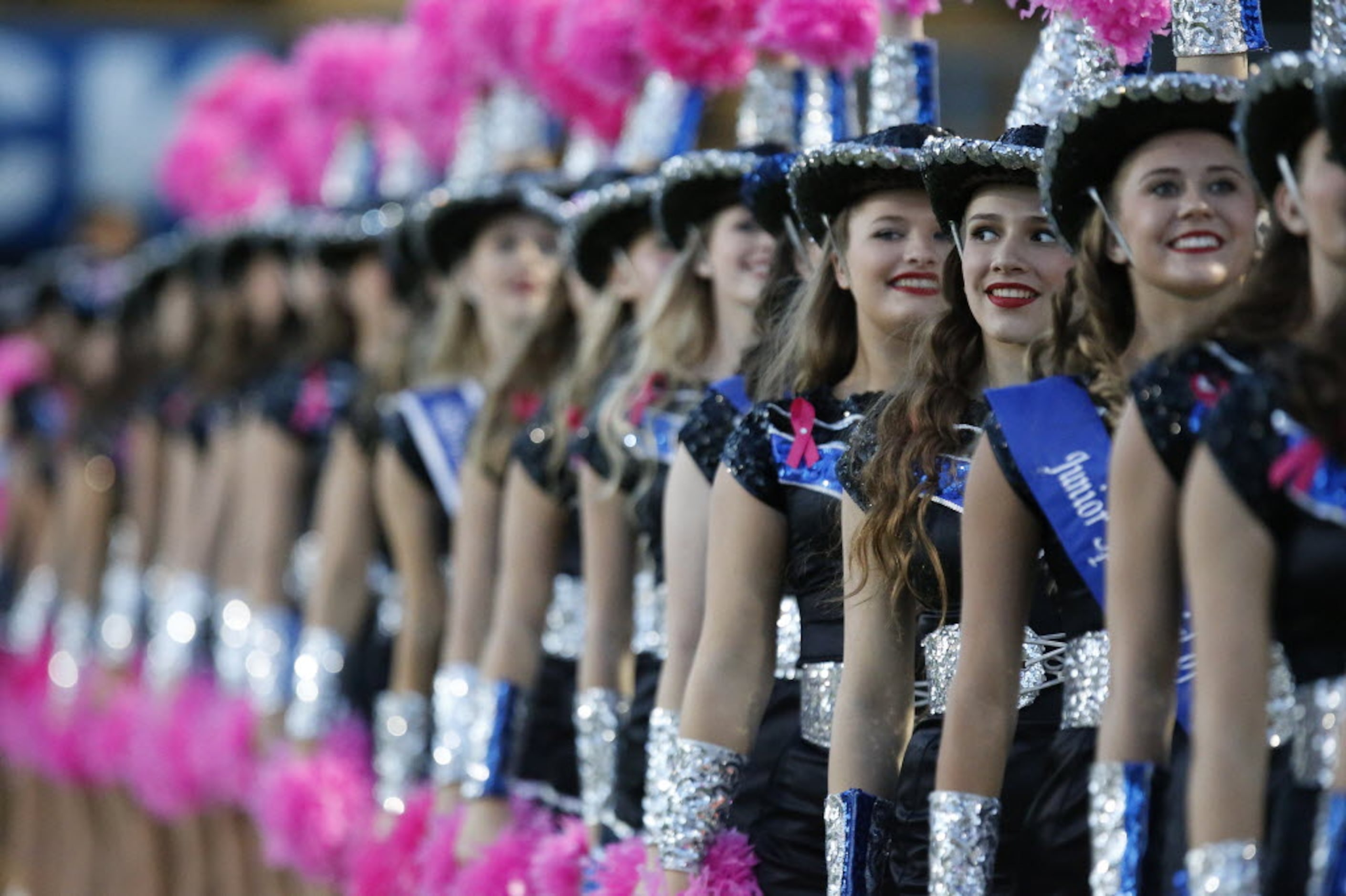 Bronte Bagwell, a member of the Plano West High School Royales, checks her surroundings as...