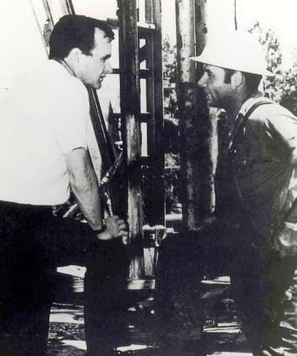 Bush speaks with an oil field worker.