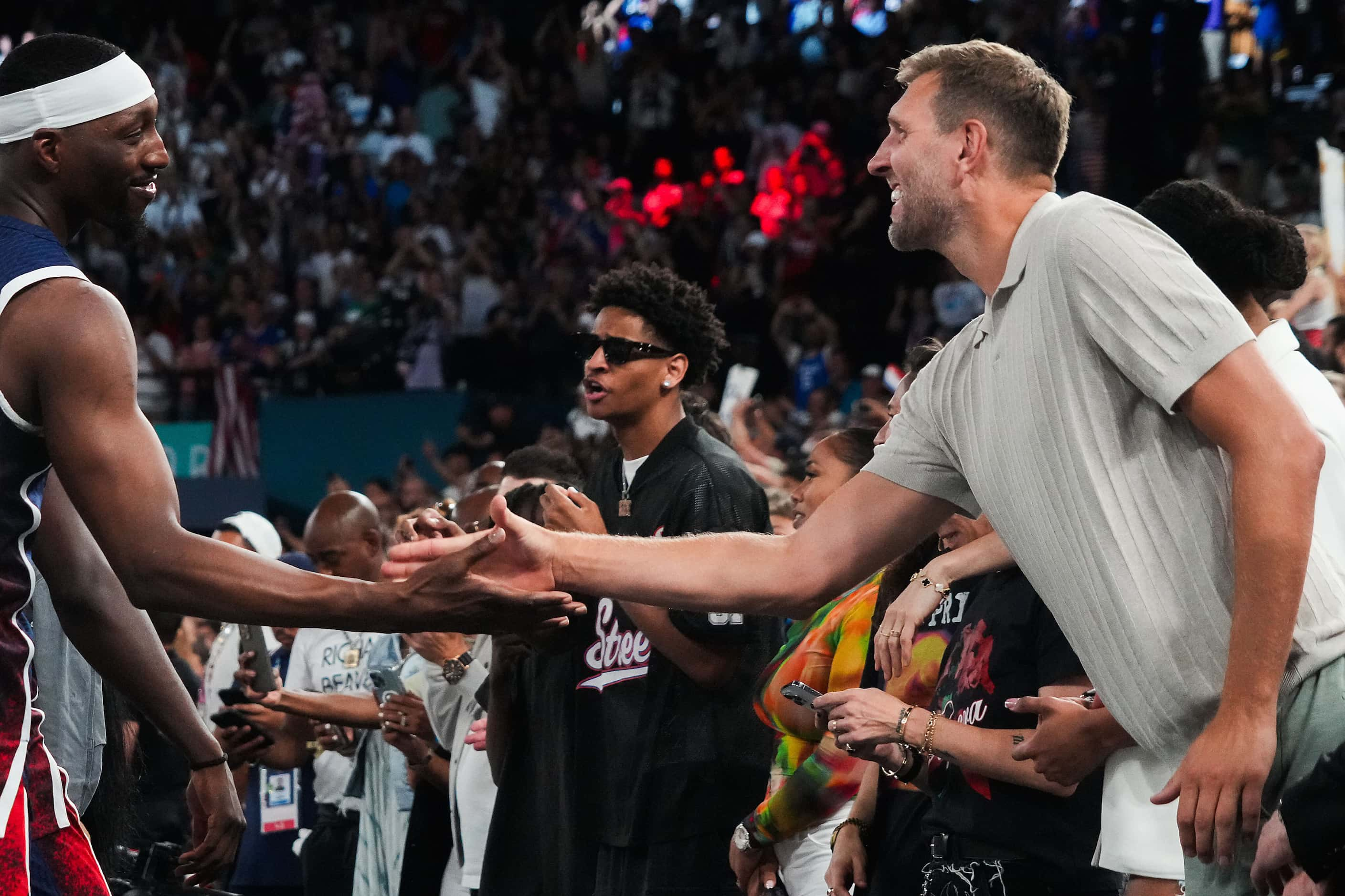 Dirk Nowitzki (right) congratulates Bam Adebayo of the United States after a victory over...