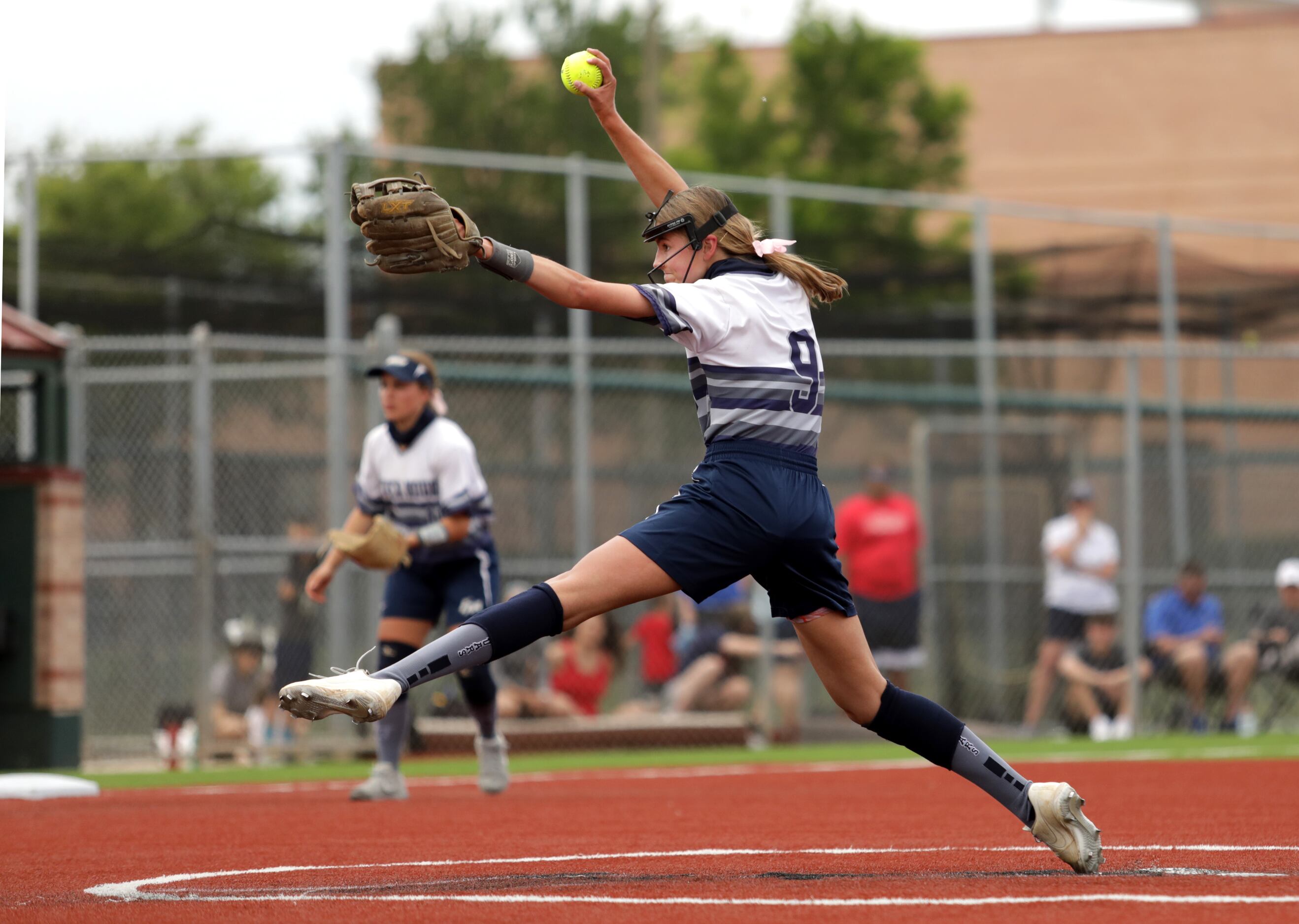 Flower Mound High School player #9, Abigail Jennings, pitches during a softball game against...