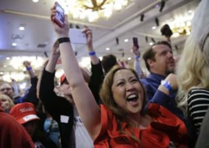  Supporters cheer during a caucus night rally for Republican presidential candidate Donald...