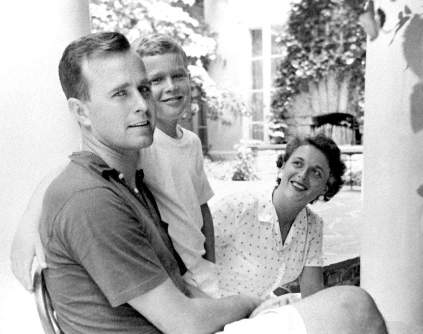 George W. Bush (center), born in 1946, was the first of George H. W. and Barbara Bush's six...