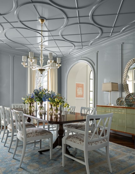 Design details on the walls or ceiling create a point of interest for a dining room, much...