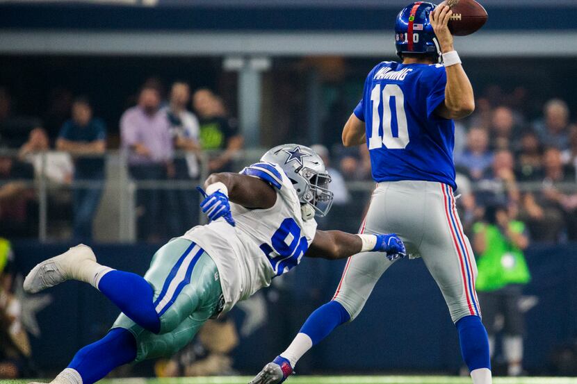 Dallas Cowboys defensive tackle Tyrone Crawford (98) narrowly misses a sack of New York...