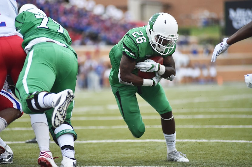 North Texas junior running back Jeffrey Wilson (26) makes his way into touchdown, Saturday,...