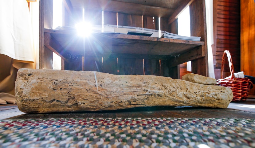 A piece of the Rock Wall lays on the floor at the Rockwall County Historical Foundation.