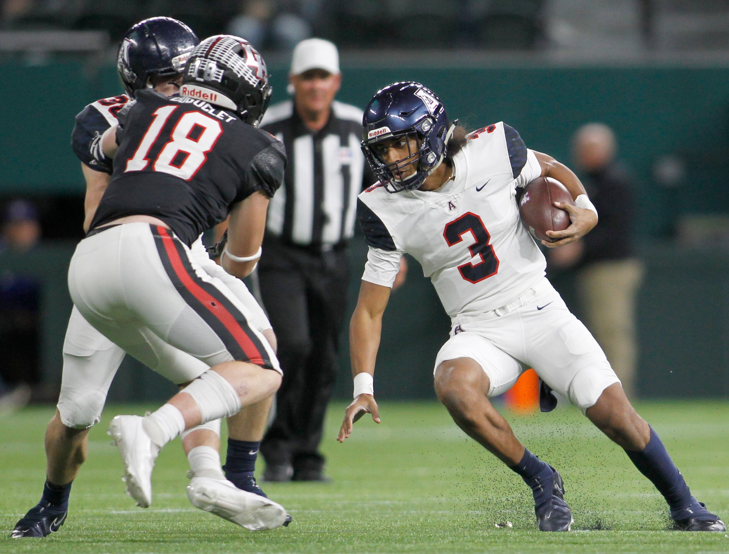 Allen quarterback makes a cut to avoid the pursuit of Lake Highlands linebacker Drew...