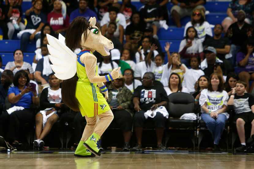 The Dallas Wings' new mascot Lightning dances for the crowd in the second quarter of the...