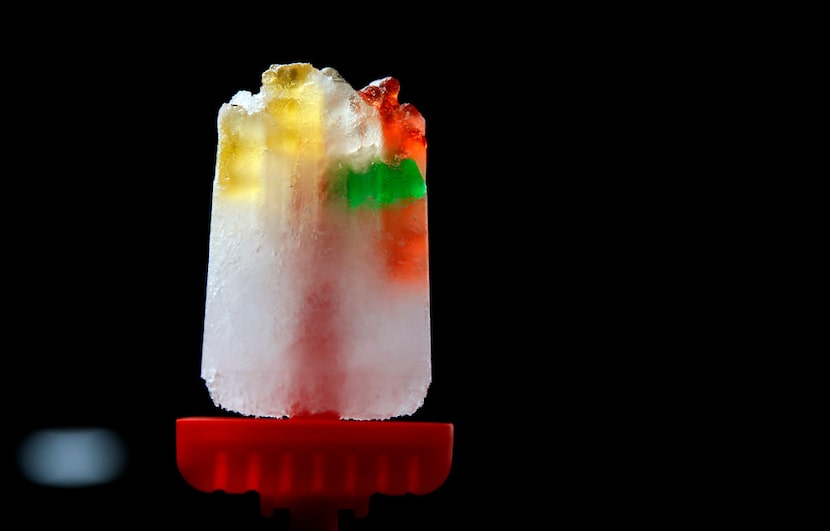 Gummy bears and lemon lime soda ice pop 