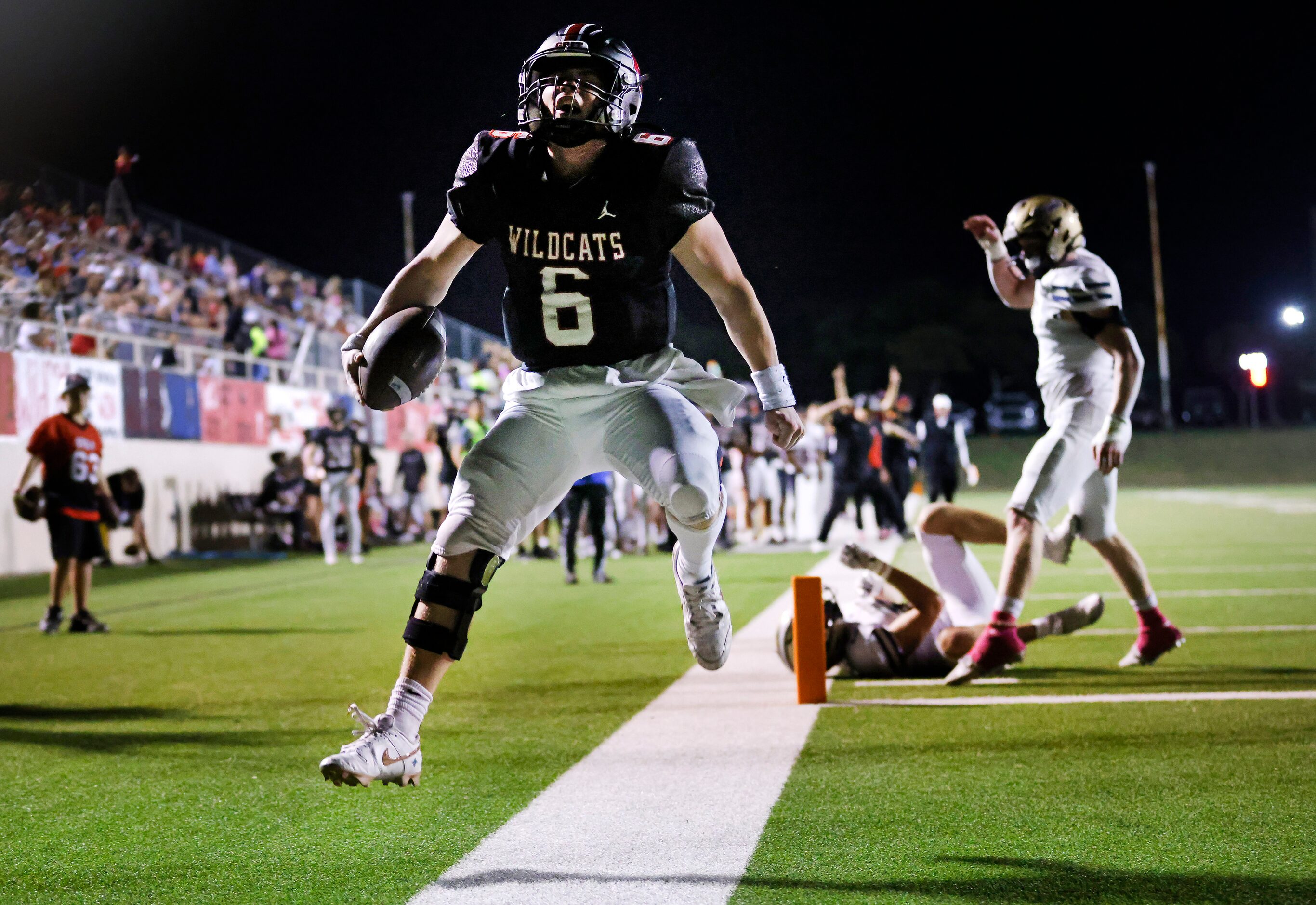 Lake Highlands High quarterback Harrison Day (6) celebrates his rushing touchdown against...