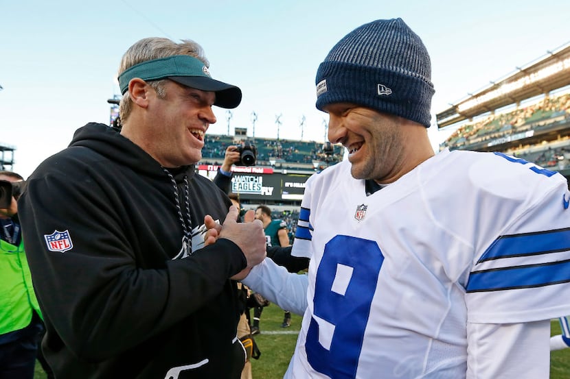 Dallas Cowboys quarterback Tony Romo (9) shakes hands with Philadelphia Eagles head coach...