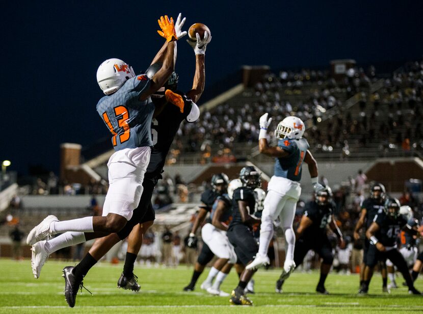 Lancaster defensive back Lorando Johnson (13) prevents a catch near the end zone by...