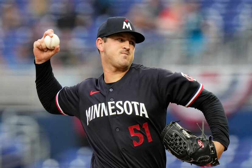 Minnesota Twins starting pitcher Tyler Mahle (51) throws during the first inning of a...
