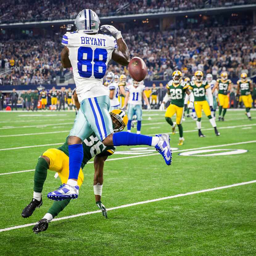 Dallas Cowboys wide receiver Dez Bryant (88) can't catch a pass as Green Bay Packers...