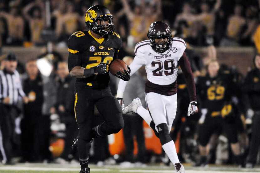 Missouri Tigers running back Henry Josey (20) runs in for a touchdown as Texas A&M Aggies...