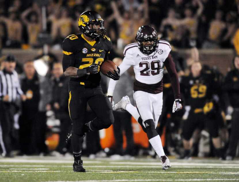 Missouri Tigers running back Henry Josey (20) runs in for a touchdown as Texas A&M Aggies...