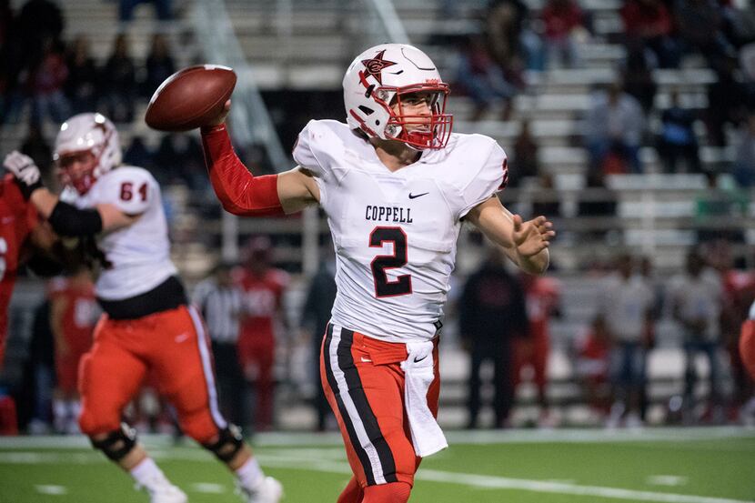 Coppell senior quarterback Brady McBride throws downfield against Skyline in the first half...