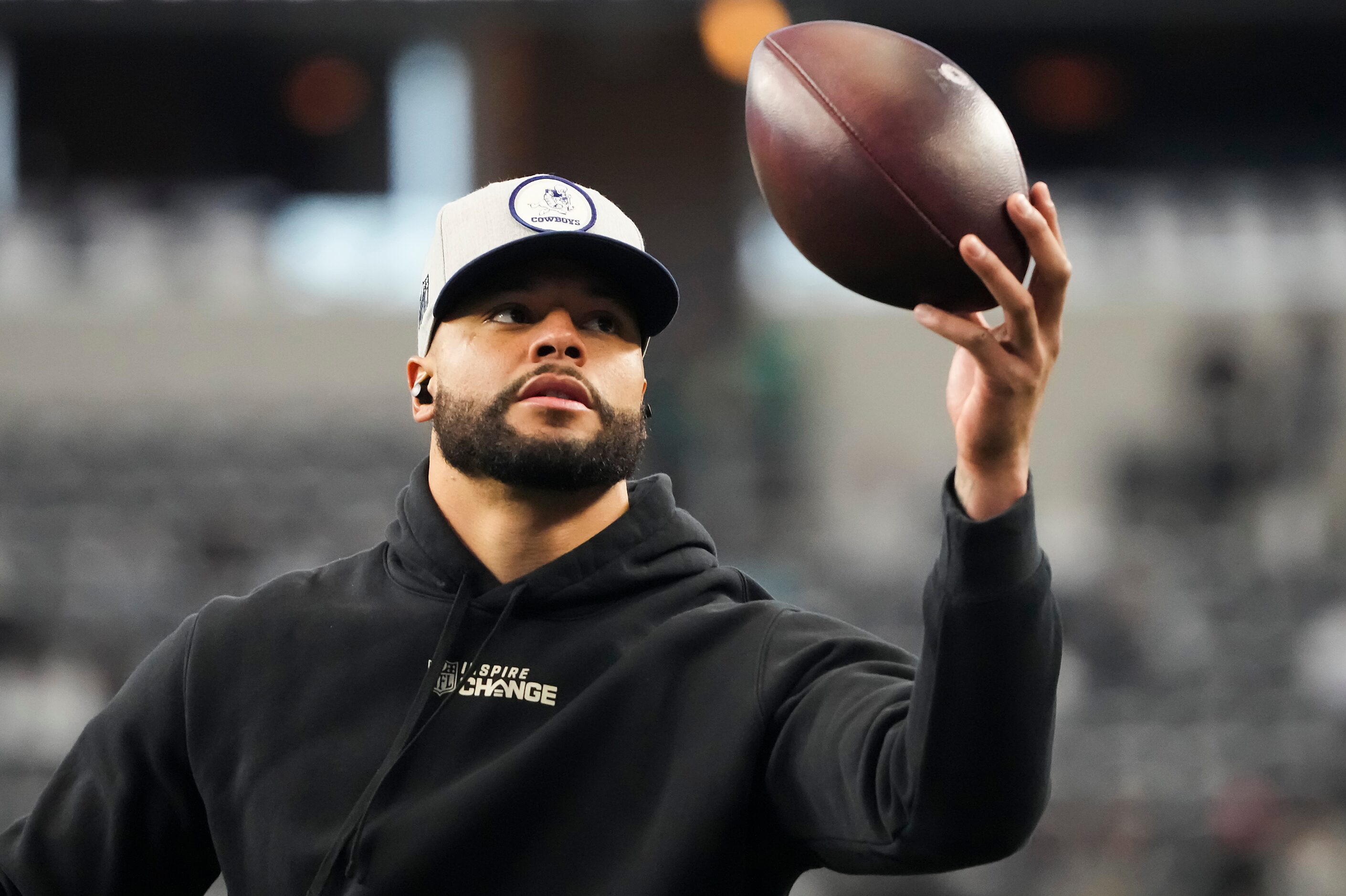 Dallas Cowboys quarterback Dak Prescott warms up before an NFL football game against the...