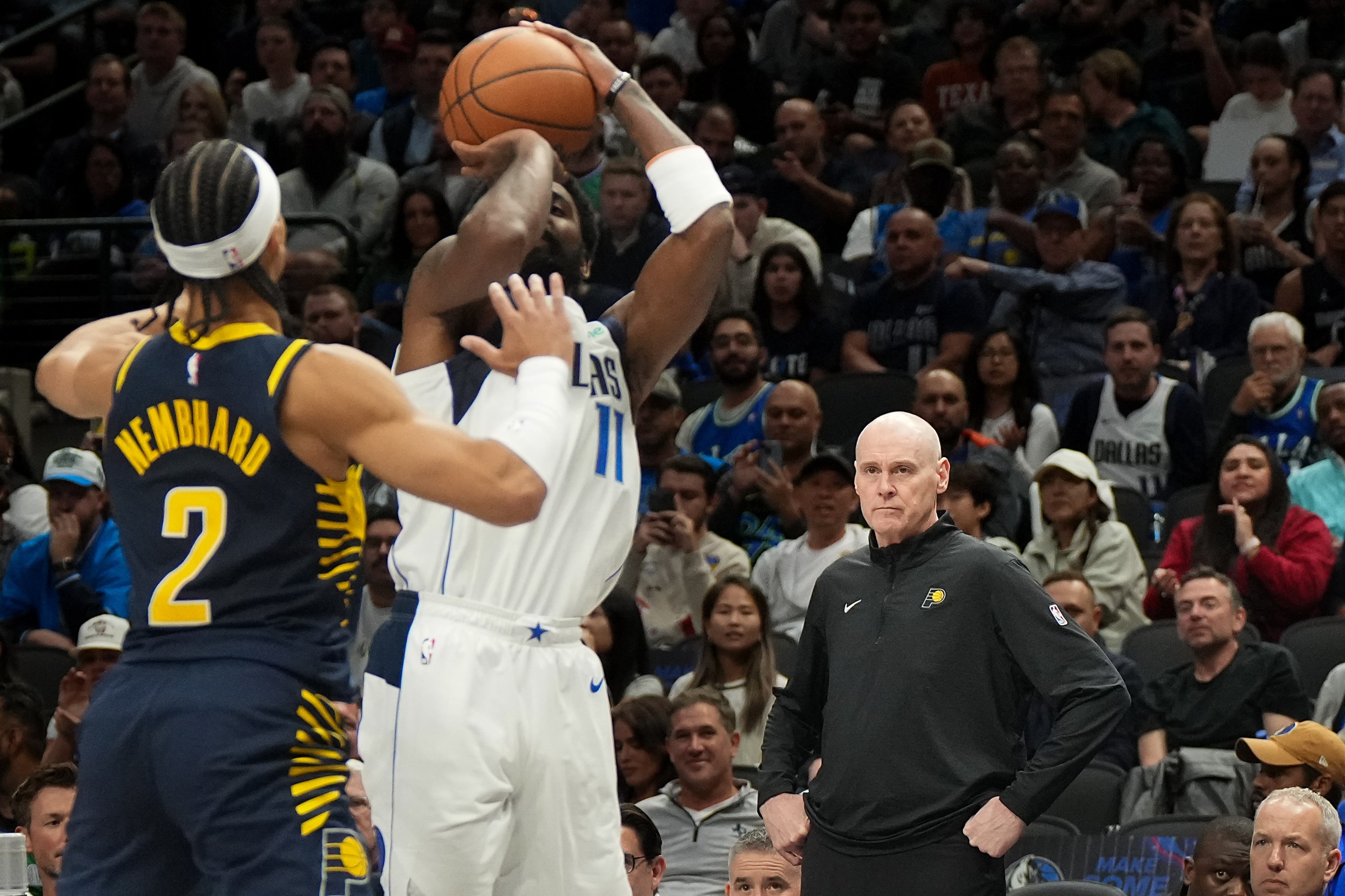 Indiana Pacers head coach Rick Carlisle looks on as Dallas Mavericks guard Kyrie Irving (11)...