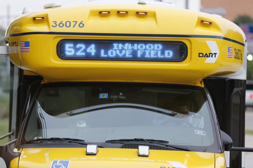 A Love Field shuttle bus waits for passengers at the Inwood/Love Field Station.